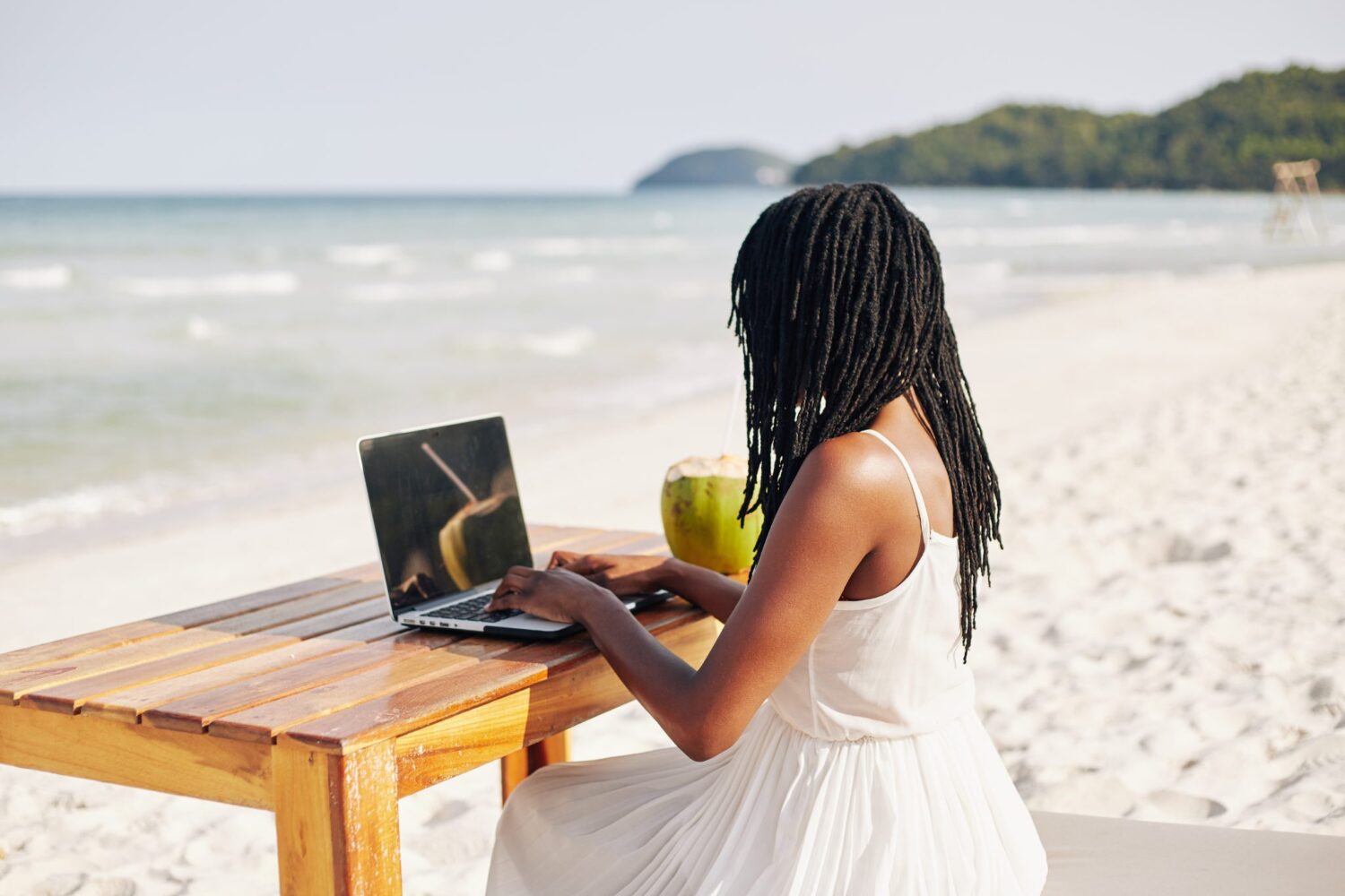 remote-worker-digital-nomad-on-beach-tax-savings-fusion-cpa